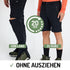 Mann mit einer ZipOff Trekkinghose aus Merino in lang und kurz, zeigt beide Optionen. Hosenfarbe ist schwarz.