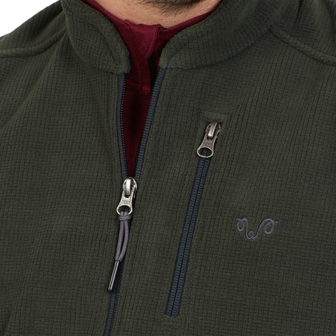 Reißverschluss einer Grünen Merino-Polarfleece Weste und Tasche.