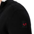 Woolona Badge an einer Strickjacke aus 100% Merinowolle