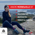 Wanderer sitzt auf einem Felsen und trägt Woolmark zertifizierten Hoodie aus Merino
